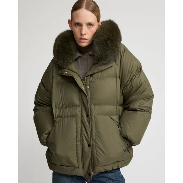 Woman wearing Yves Salomon shearling fur coat – luxury outerwear at Luxury Shoes 