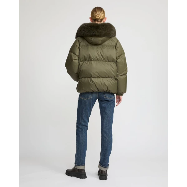 Woman wearing Yves Salomon shearling fur coat – luxury outerwear at Luxury Shoes 