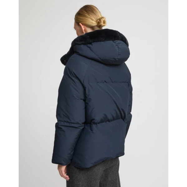 Woman wearing Yves Salomon shearling fur coat – luxury outerwear at Luxury Shoes 