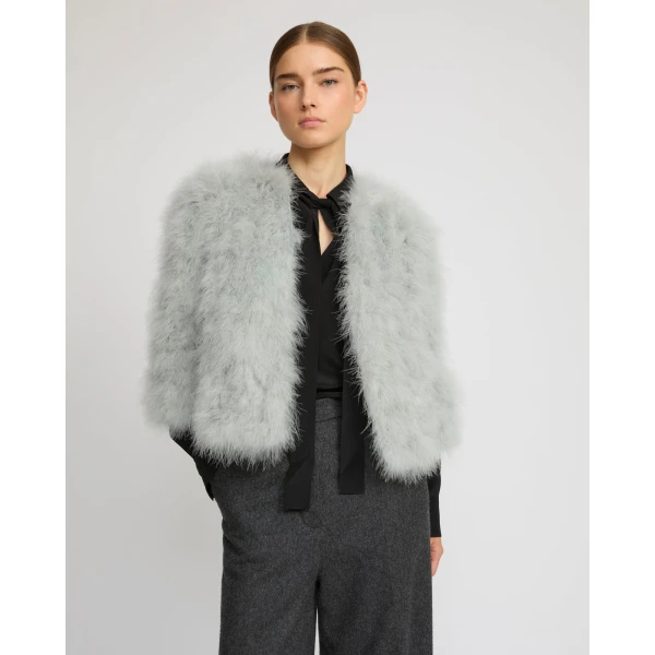 Woman wearing Yves Salomon shearling fur coat – luxury outerwear at Luxury Shoes 