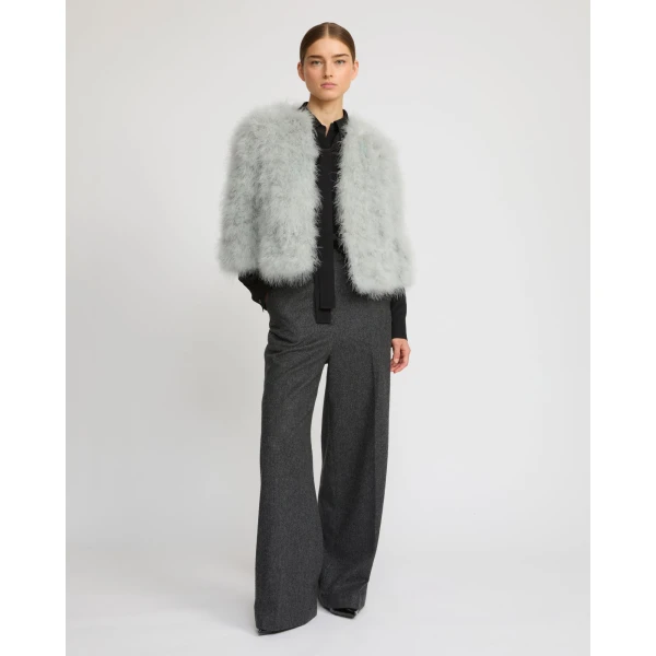 Woman wearing Yves Salomon shearling fur coat – luxury outerwear at Luxury Shoes 