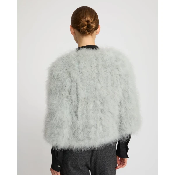 Woman wearing Yves Salomon shearling fur coat – luxury outerwear at Luxury Shoes 