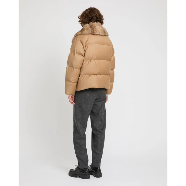 Woman wearing Yves Salomon shearling fur coat – luxury outerwear at Luxury Shoes 