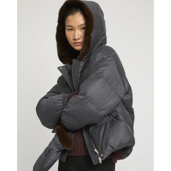 Woman wearing Yves Salomon shearling fur coat – luxury outerwear at Luxury Shoes 
