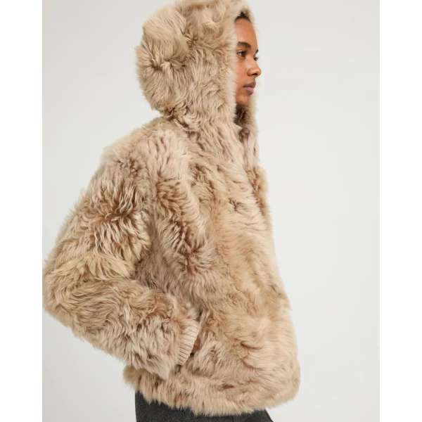 Woman wearing Yves Salomon shearling fur coat – luxury outerwear at Luxury Shoes 