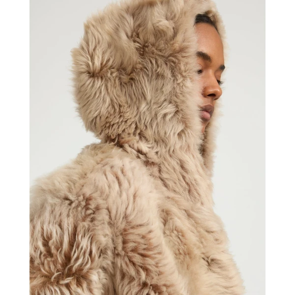 Woman wearing Yves Salomon shearling fur coat – luxury outerwear at Luxury Shoes 