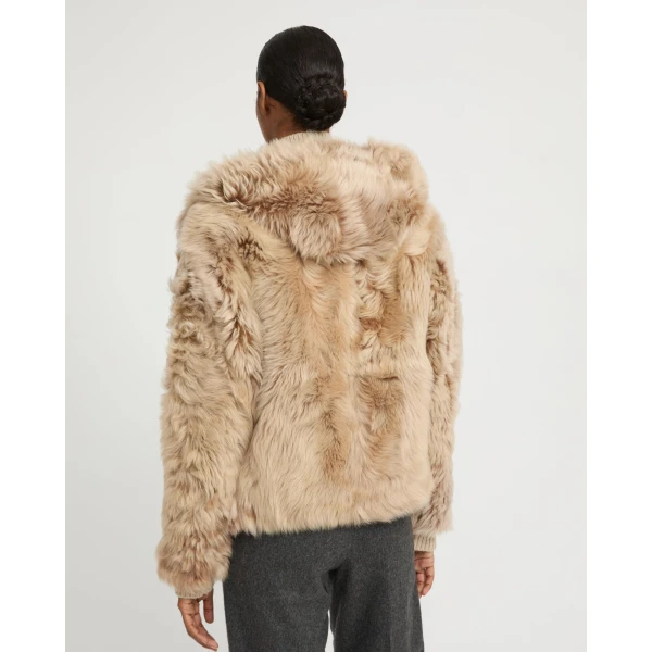 Woman wearing Yves Salomon shearling fur coat – luxury outerwear at Luxury Shoes 