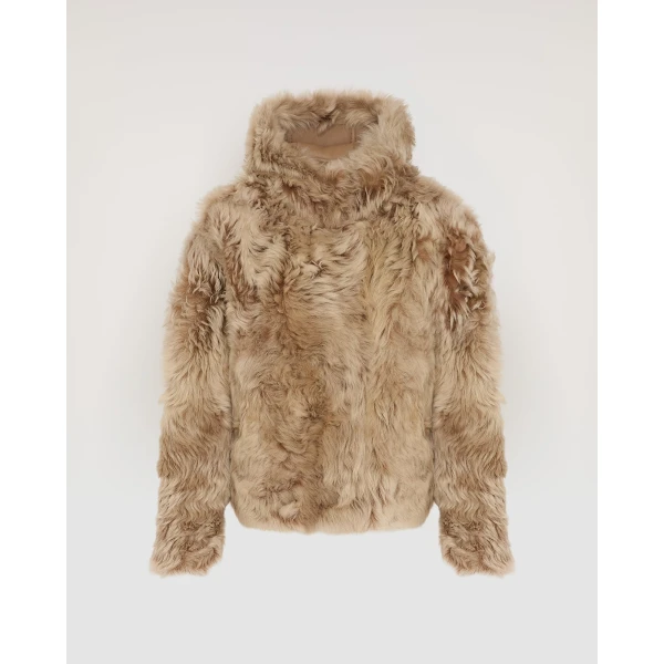 Woman wearing Yves Salomon shearling fur coat – luxury outerwear at Luxury Shoes 