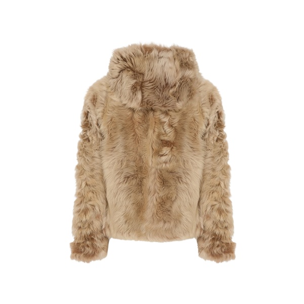 Woman wearing Yves Salomon shearling fur coat – luxury outerwear at Luxury Shoes 