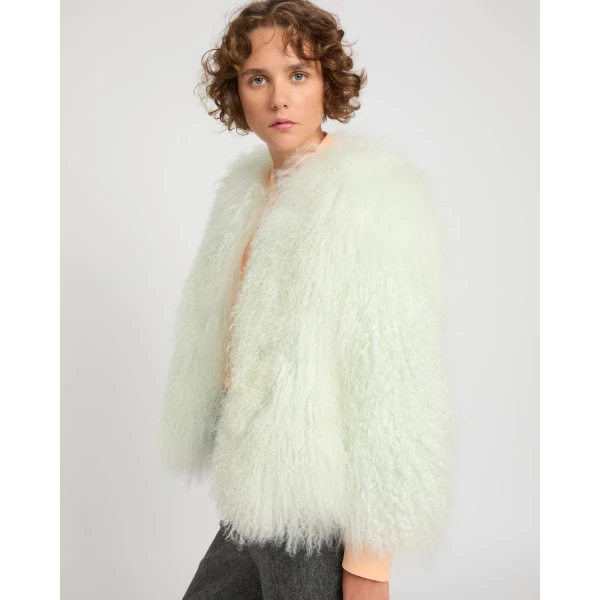 Woman wearing Yves Salomon shearling fur coat – luxury outerwear at Luxury Shoes 