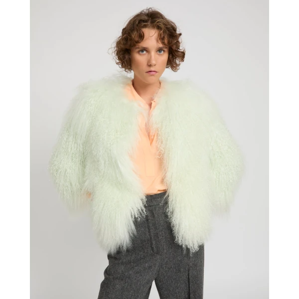 Woman wearing Yves Salomon shearling fur coat – luxury outerwear at Luxury Shoes 