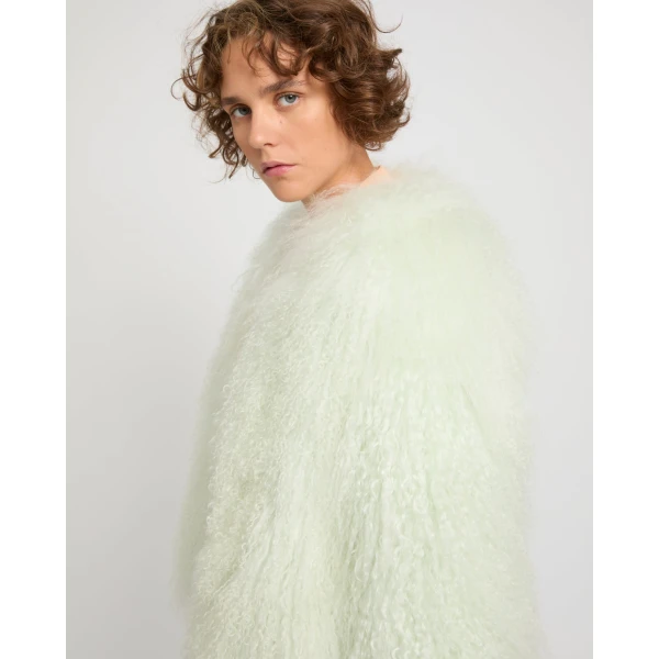 Woman wearing Yves Salomon shearling fur coat – luxury outerwear at Luxury Shoes 