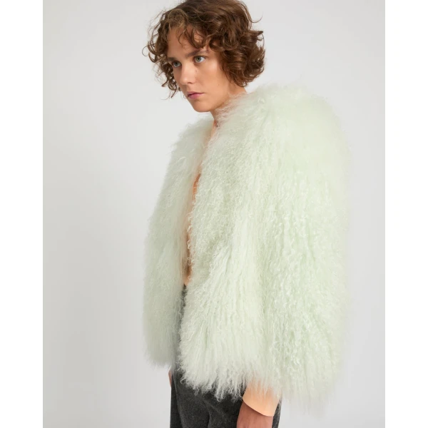 Woman wearing Yves Salomon shearling fur coat – luxury outerwear at Luxury Shoes 