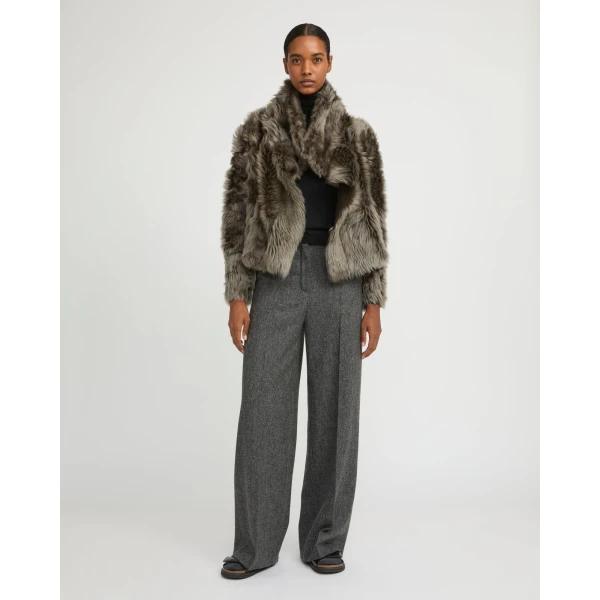 Woman wearing Yves Salomon shearling fur coat – luxury outerwear at Luxury Shoes 