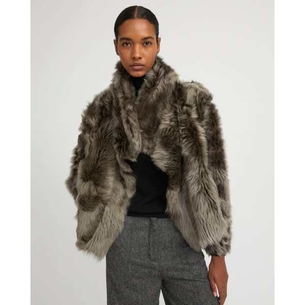Woman wearing Yves Salomon shearling fur coat – luxury outerwear at Luxury Shoes 