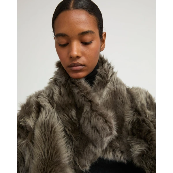 Woman wearing Yves Salomon shearling fur coat – luxury outerwear at Luxury Shoes 