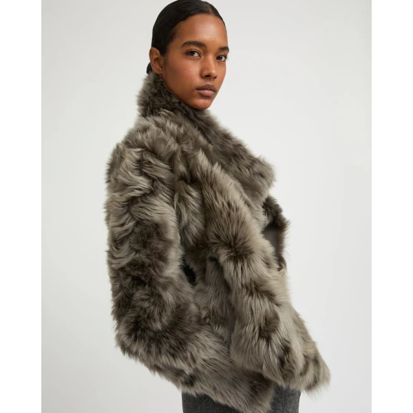 Woman wearing Yves Salomon shearling fur coat – luxury outerwear at Luxury Shoes 