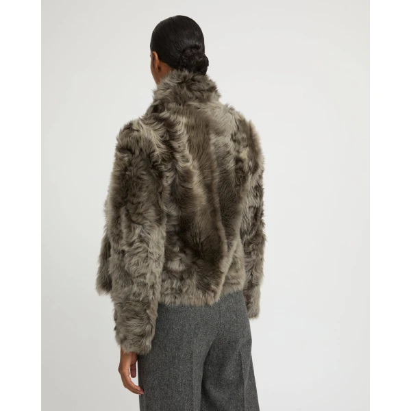 Woman wearing Yves Salomon shearling fur coat – luxury outerwear at Luxury Shoes 