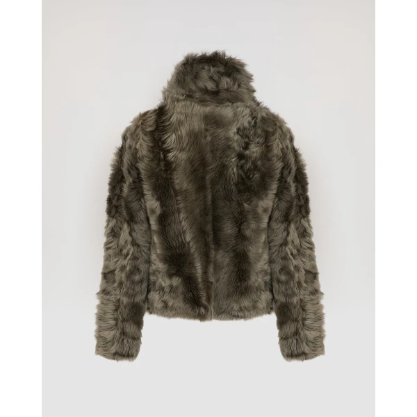Woman wearing Yves Salomon shearling fur coat – luxury outerwear at Luxury Shoes 