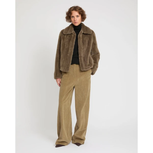Woman wearing Yves Salomon shearling fur coat – luxury outerwear at Luxury Shoes 