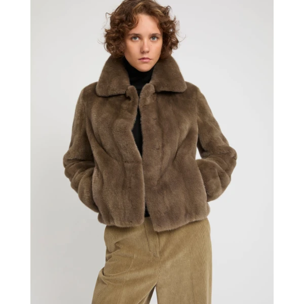 Woman wearing Yves Salomon shearling fur coat – luxury outerwear at Luxury Shoes 