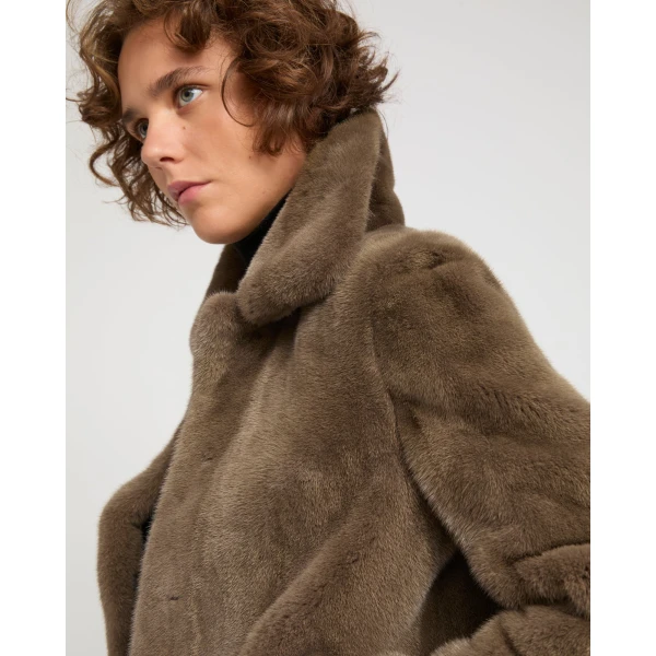 Woman wearing Yves Salomon shearling fur coat – luxury outerwear at Luxury Shoes 