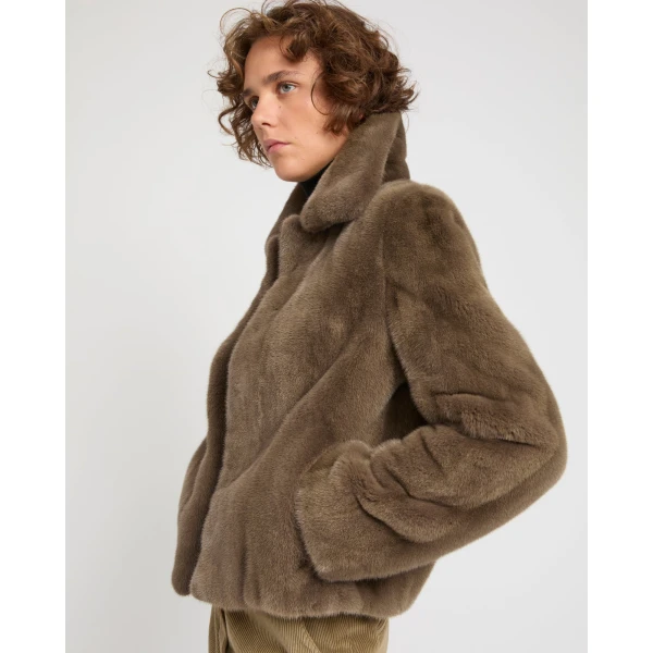 Woman wearing Yves Salomon shearling fur coat – luxury outerwear at Luxury Shoes 
