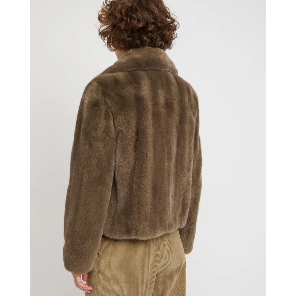 Woman wearing Yves Salomon shearling fur coat – luxury outerwear at Luxury Shoes 