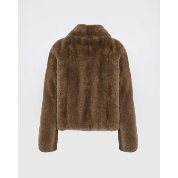 Woman wearing Yves Salomon shearling fur coat – luxury outerwear at Luxury Shoes 