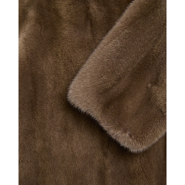 Woman wearing Yves Salomon shearling fur coat – luxury outerwear at Luxury Shoes 