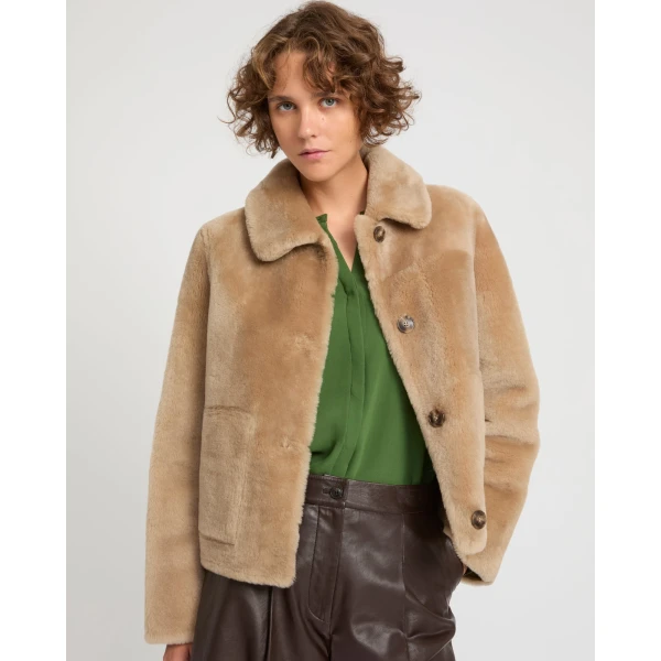 Woman wearing Yves Salomon shearling fur coat – luxury outerwear at Luxury Shoes 