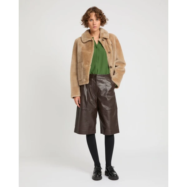 Woman wearing Yves Salomon shearling fur coat – luxury outerwear at Luxury Shoes 