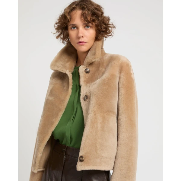 Woman wearing Yves Salomon shearling fur coat – luxury outerwear at Luxury Shoes 