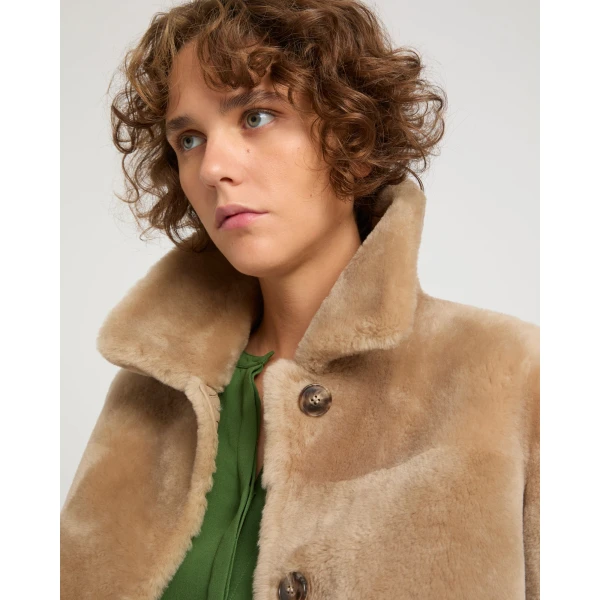Woman wearing Yves Salomon shearling fur coat – luxury outerwear at Luxury Shoes 