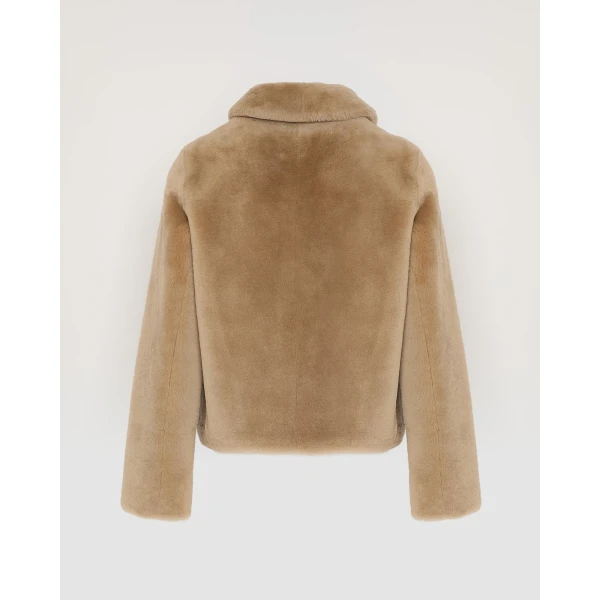 Woman wearing Yves Salomon shearling fur coat – luxury outerwear at Luxury Shoes 