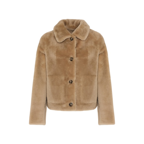 Woman wearing Yves Salomon shearling fur coat – luxury outerwear at Luxury Shoes 