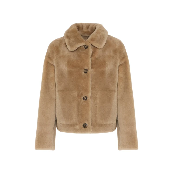 Woman wearing Yves Salomon shearling fur coat – luxury outerwear at Luxury Shoes 