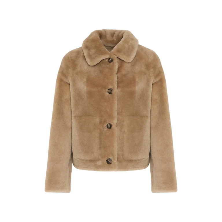 Woman wearing Yves Salomon shearling fur coat – luxury outerwear at Luxury Shoes 
