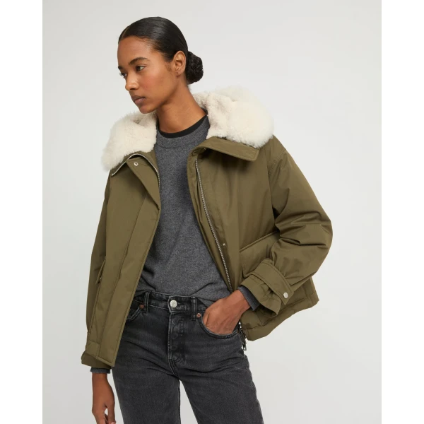 Woman wearing Yves Salomon shearling fur coat – luxury outerwear at Luxury Shoes 