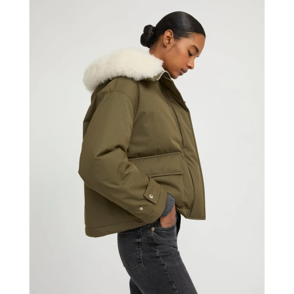 Woman wearing Yves Salomon shearling fur coat – luxury outerwear at Luxury Shoes 