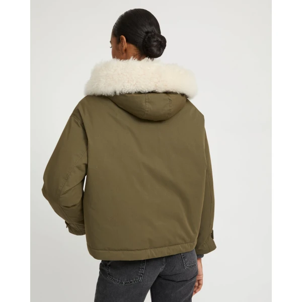 Woman wearing Yves Salomon shearling fur coat – luxury outerwear at Luxury Shoes 