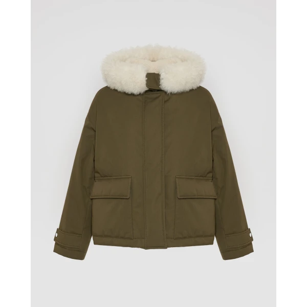 Woman wearing Yves Salomon shearling fur coat – luxury outerwear at Luxury Shoes 
