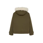 Woman wearing Yves Salomon shearling fur coat – luxury outerwear at Luxury Shoes 