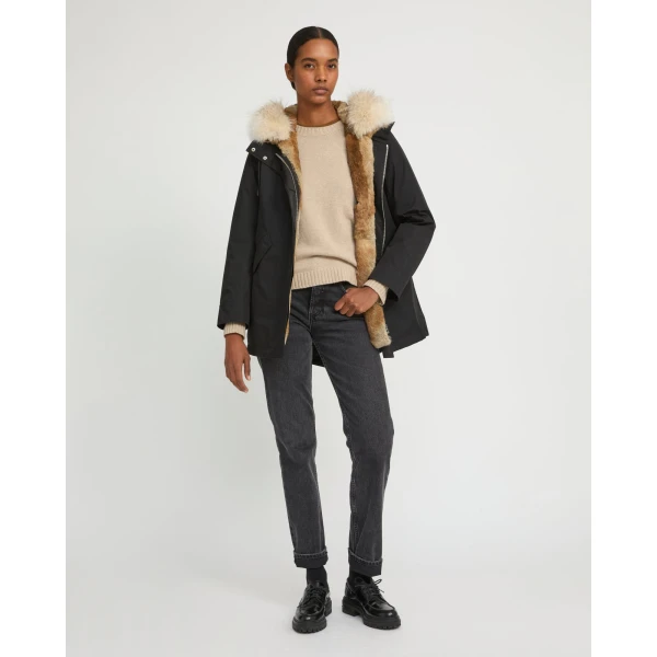 Woman wearing Yves Salomon shearling fur coat – luxury outerwear at Luxury Shoes 
