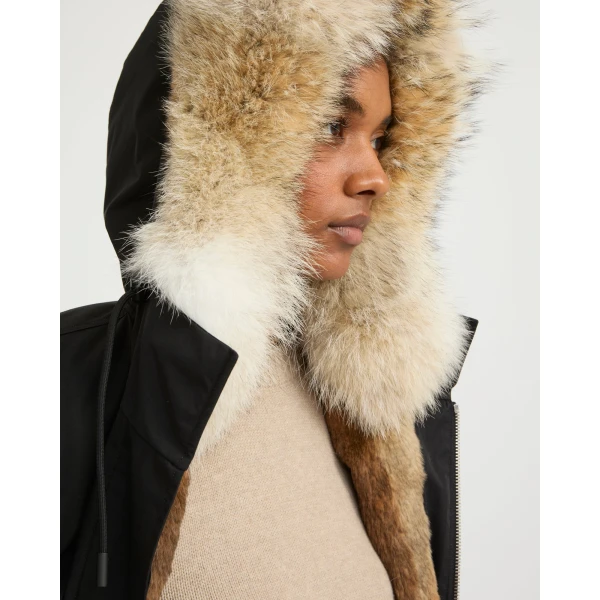 Woman wearing Yves Salomon shearling fur coat – luxury outerwear at Luxury Shoes 
