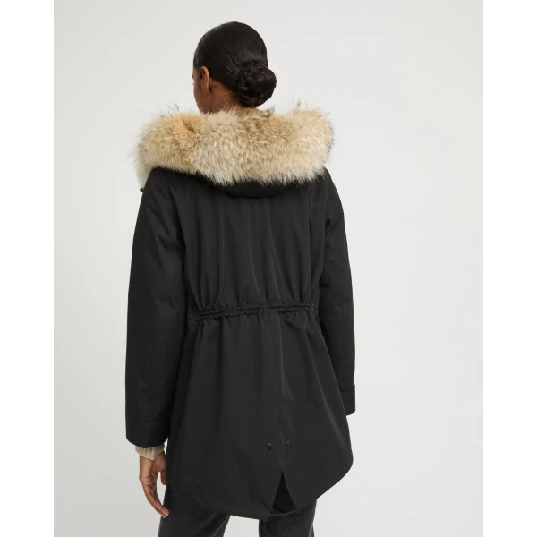 Woman wearing Yves Salomon shearling fur coat – luxury outerwear at Luxury Shoes 