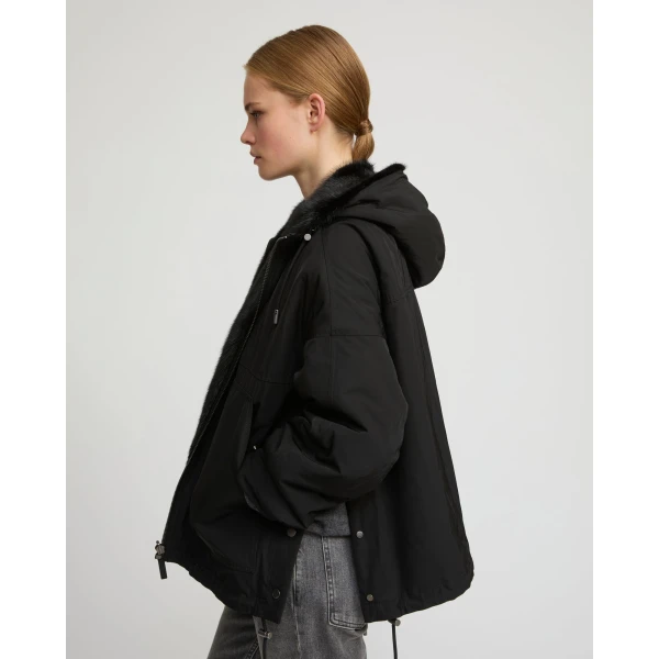 Woman wearing Yves Salomon shearling fur coat – luxury outerwear at Luxury Shoes 