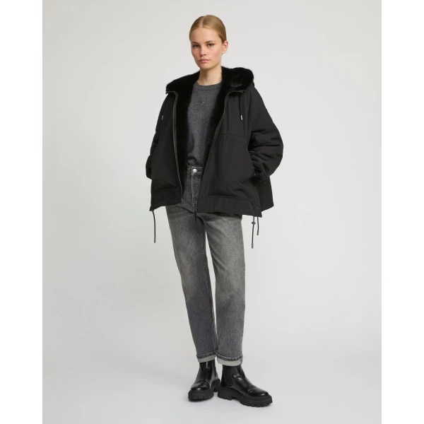Woman wearing Yves Salomon shearling fur coat – luxury outerwear at Luxury Shoes 