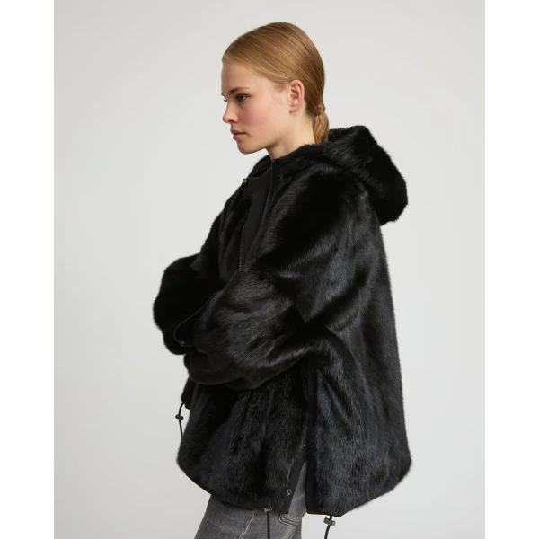 Woman wearing Yves Salomon shearling fur coat – luxury outerwear at Luxury Shoes 