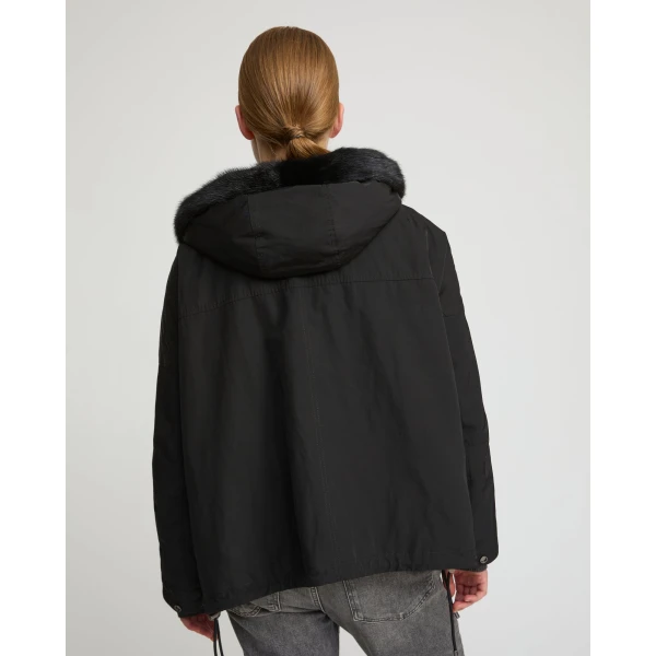 Woman wearing Yves Salomon shearling fur coat – luxury outerwear at Luxury Shoes 